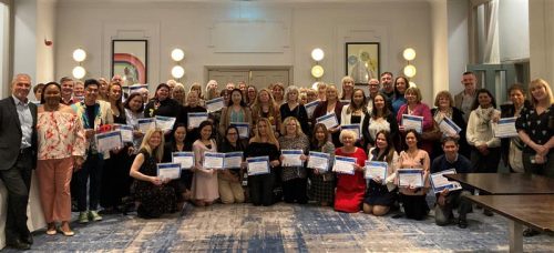 Image of colleagues at Long Service Awards event at Brighton Metropole Hotel