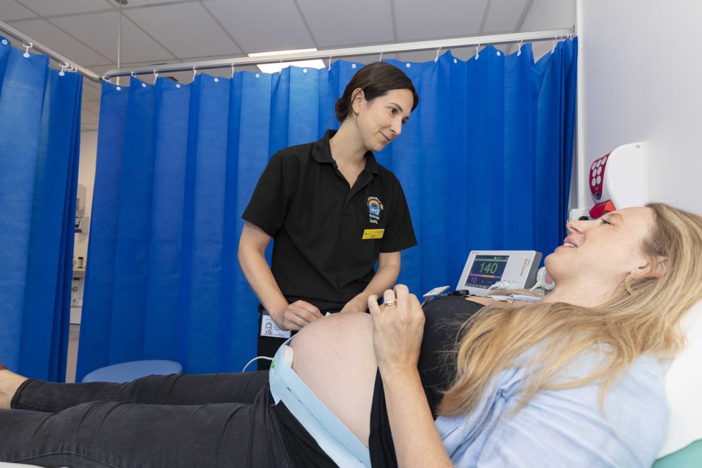 A midwife carrying out an assessment