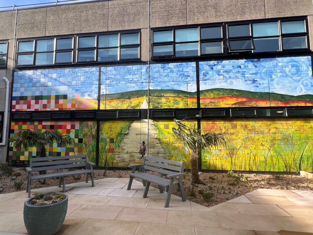 A large mural painted on a wall in the new garden at Worthing Hospital