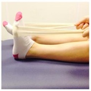 stretching foot with towel