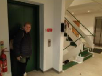 Maria at the entrance of the lift.