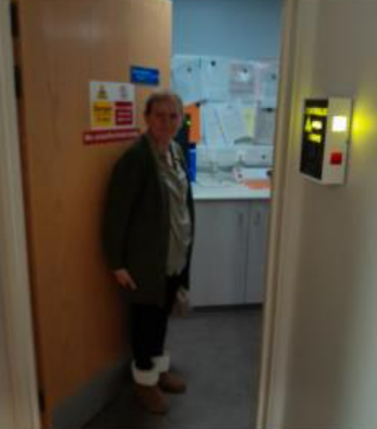 Maria going into a room for an x-ray.