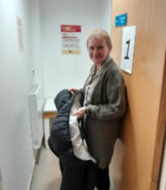 Maria getting dressed after her X-Ray.