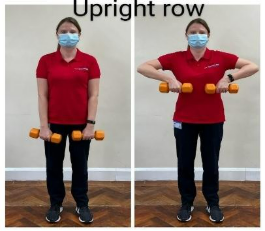 A person wearing a face mask holding weights