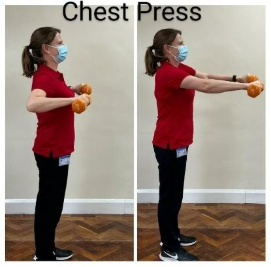 A person holding out weights. 