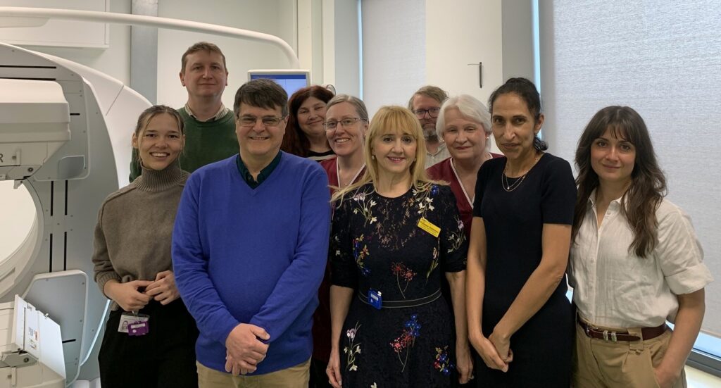 Sussex patient Darius Aibara (in blue) with clinicians administering his treatment at Royal Sussex County Hospital