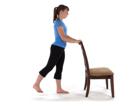 A person practicing a hip extension. © Wibbi