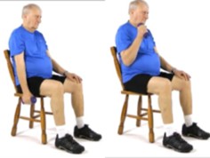 A person sitting on a chair bending their arm.