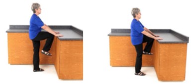 Woman holding onto a table and marching on the spot