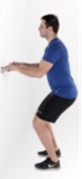 Man holding onto a hard surface whilst doing a mini squat.