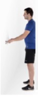 Man holding onto a hard surface whilst doing a mini squat.