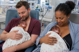 Parents holding babies skin-to-skin on their chests - kangaroo care.