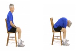 A person sitting on a chair and then reaching towards the floor.
