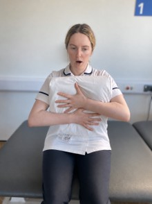 Illustration showing how to support your chest when coughing during your deep breathing exercises