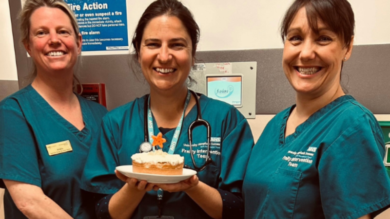 Frailty Intervention Team posing with their cake