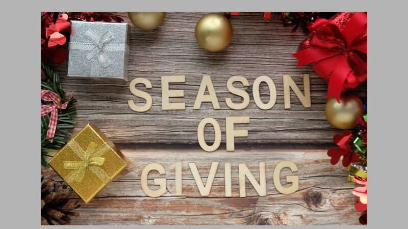 Christmas background with text Season of Giving
