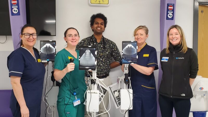 Nisal with clinical colleagues holding ultrasound devices