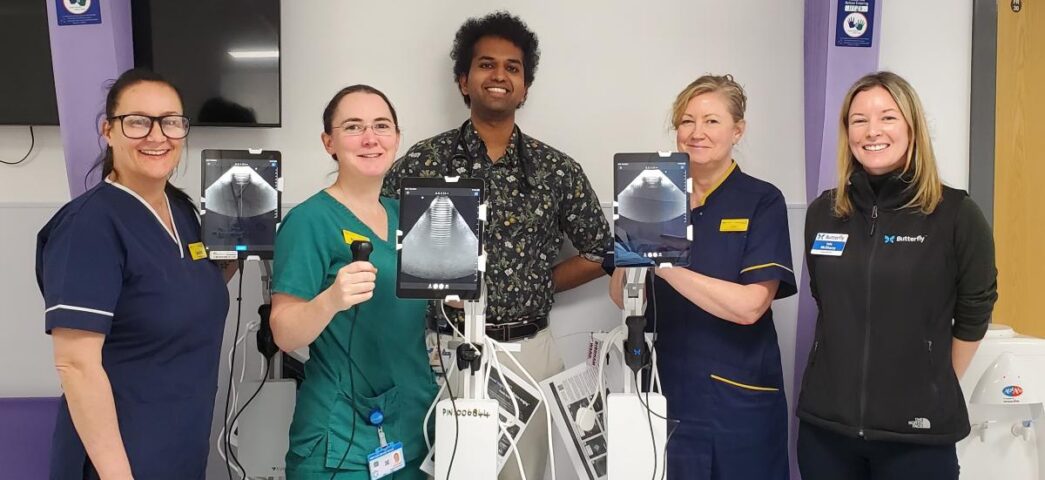 Nisal with clinical colleagues holding ultrasound devices