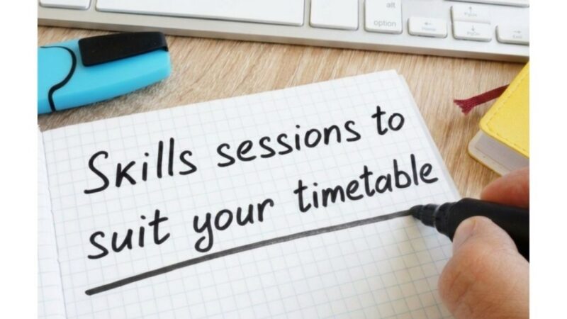 A desk with a keyboard and a notepad saying "Skills sessions to suit your timetable"