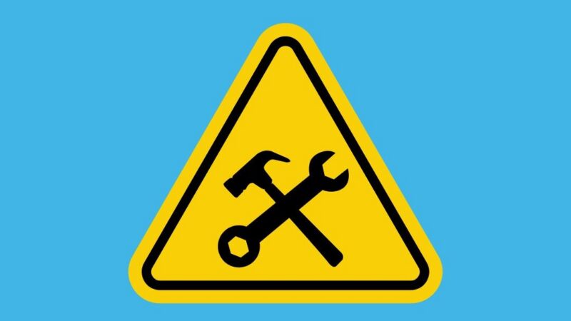 Yellow sign depicting closure on a blue background