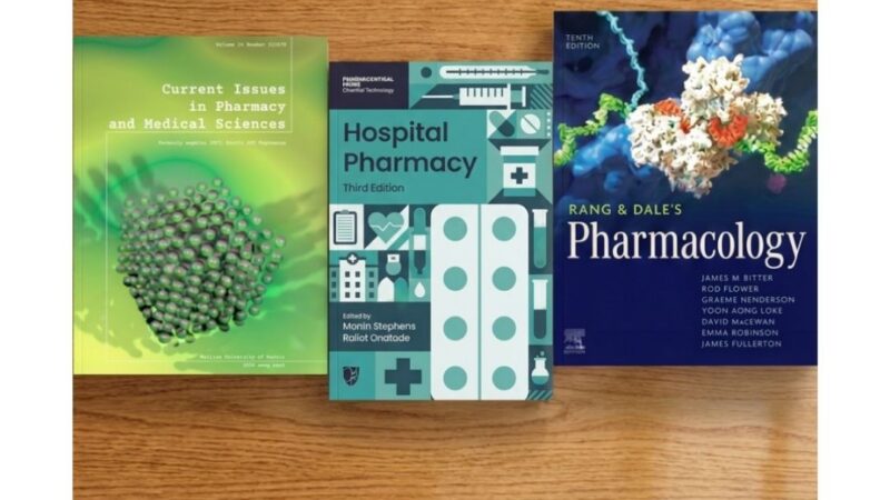 Our book, e book and journal of the month displayed on a table top