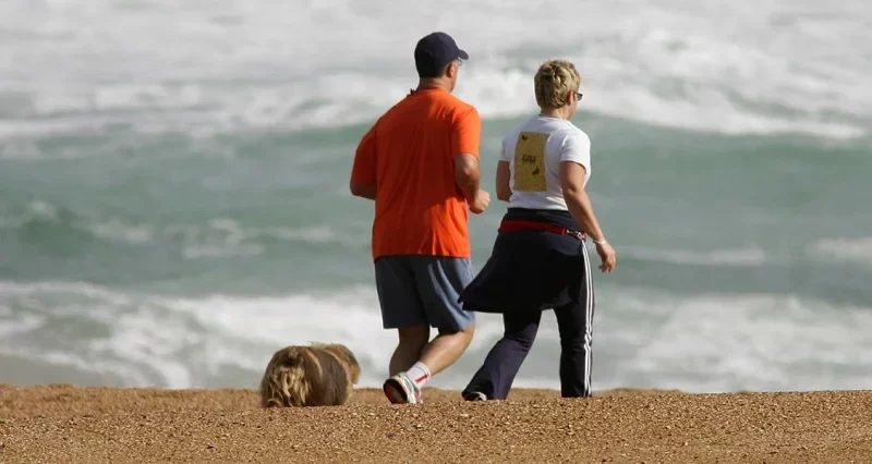 couple jogging on beach