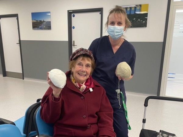 Bella and Sarah with the knitted prostheses