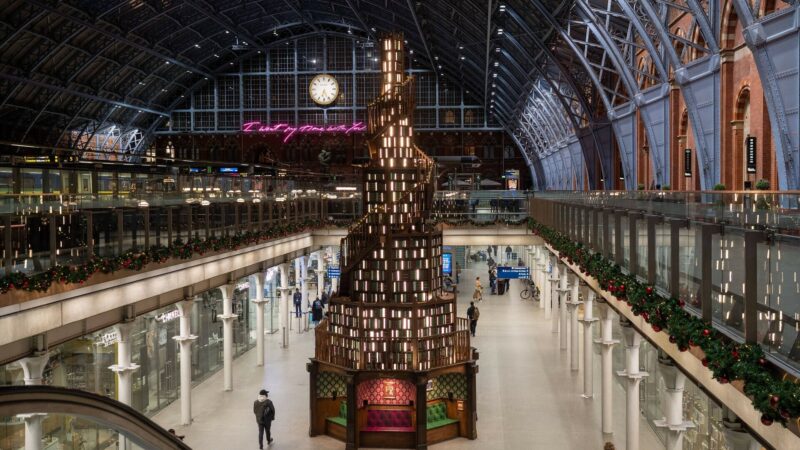 Christmas tree made from books in London St Pancras Station